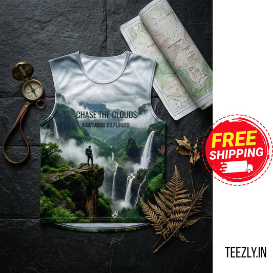 T-shirt with nature design and 'Chase the Clouds' text on a dark surface with maps and compass.