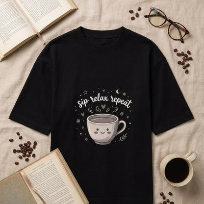 Black Oversize Tshirt with printed text 'sip relax repeat' and coffee mug