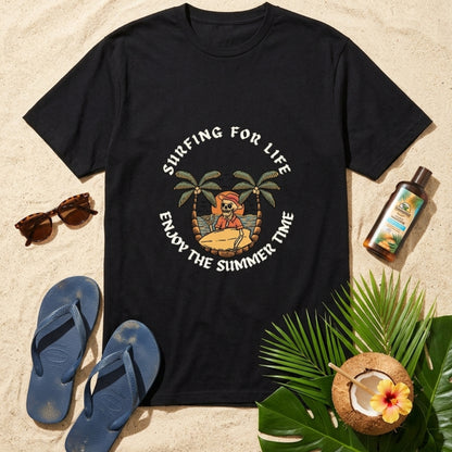 Black t-shirt with 'Surfing for Life, Enjoy the Summer Time' design on a sandy background with flip-flops, sunglasses, and a coconut drink.