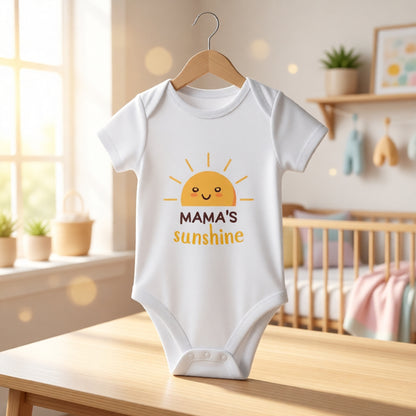 White baby Romper with 'Mama's Sunshine' design on a wooden hanger in a nursery.