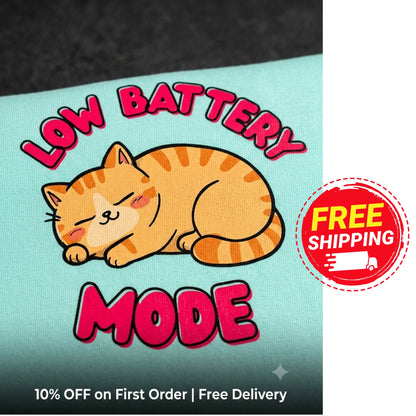 Cartoon cat with 'Low Battery Mode' text on a promotional card with free shipping offer.